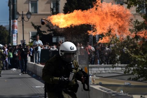Firebombs explode in front of riot police Wednesday.