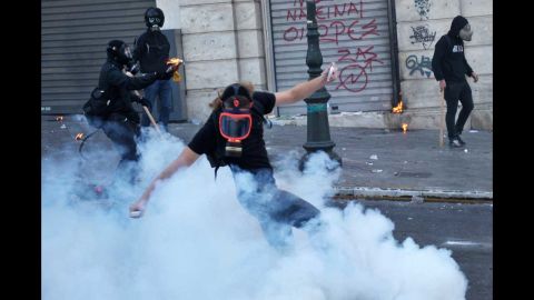 Youths face riot police in Athens on Wednesday.