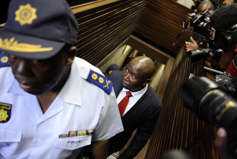 Malema, who was ousted from the ruling African National Congress earlier this year after making a string of attacks against the government, is led into court on September 26. He denies the charges, saying they are politically motivated.