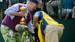Bill Murray pretends to steal the Ryder Cup at the Captains & Celebrity Scramble September 25, 2012 in Medinah, Illinois.