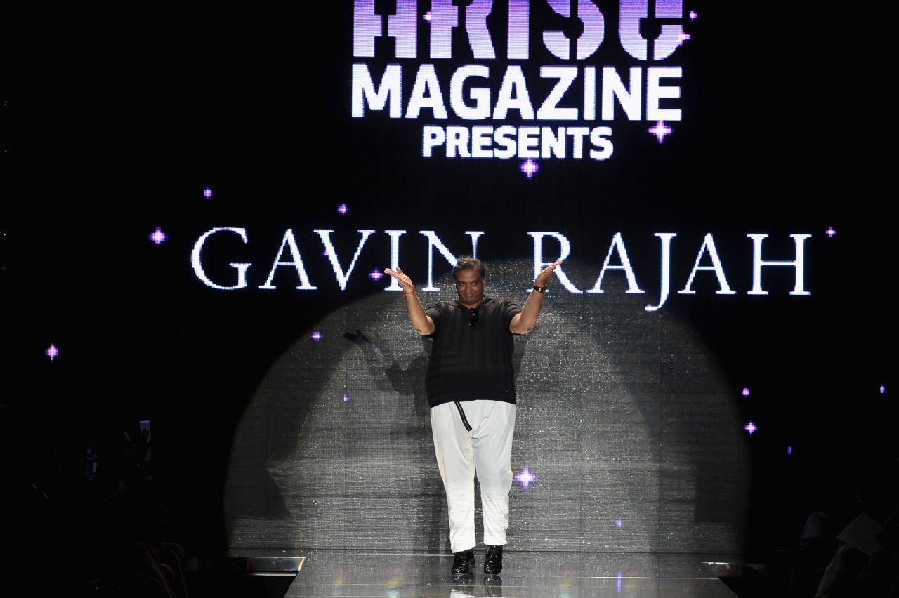 South African designer Gavin Rajah walks the runway at the Lincoln Center.