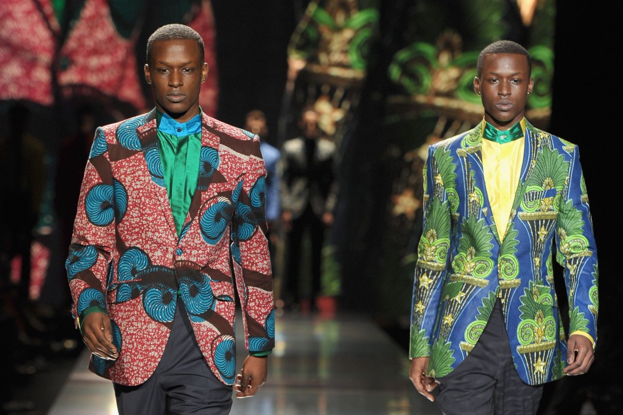 Ozwald Boateng's collections included "somber black suiting, casual sand and salmon linen shorts and blazers and some riotously colourful shirts and trousers made from Vlisco wax prints," according to Jennings. 