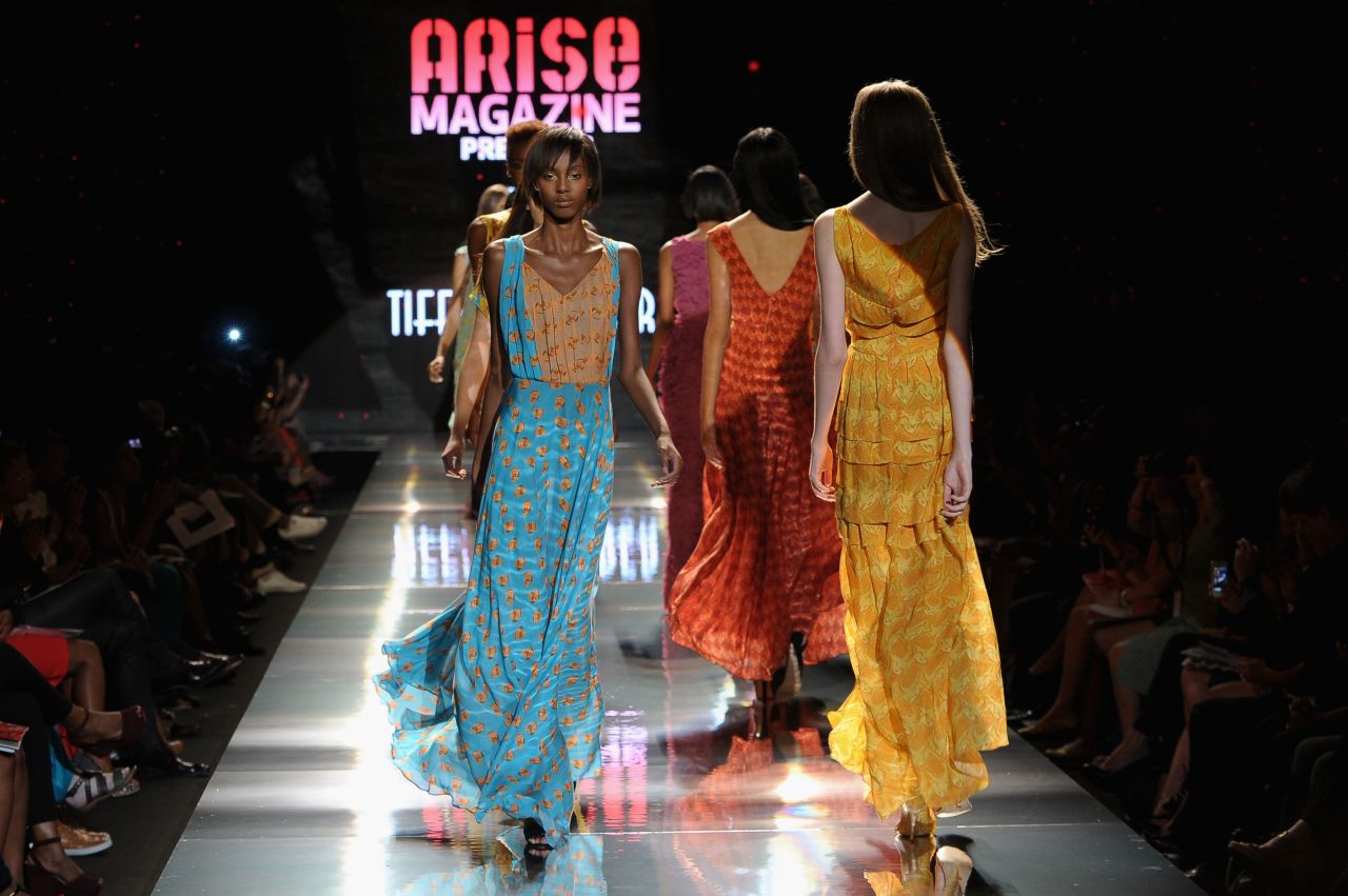 Folake Folarin-Coker's creations for Tiffany Amber "offered up floaty resort-wear with decadent 1970s overtones," according to Jennings. "Entitled The Rhythms Of Africa, jewel-coloured silks were hand printed with drum motifs and formed waist-cinching maxi dresses, jumpsuits and rompers." 