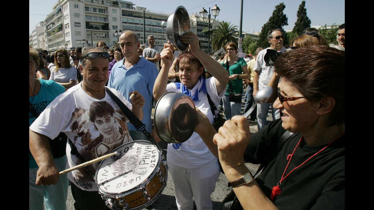 Protesters shout slogans and play makeshift instruments Wednesday.