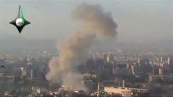 From YouTube.com/Amateur Video September 26, 2012 Damascus, Syria smoke rising from Two huge explosions rocked the City of Damascus few minutes ago one of them was in the Umayyad Square and the second explosion was near Kafr Souseh (western Damascus district), followed by heavy gunfire from medium range machine guns, and there were no information on the extent of the damage and losses until the moment.  

Source:  YouTube  *Please note: CNN cannot independently confirm the authenticity of this video.