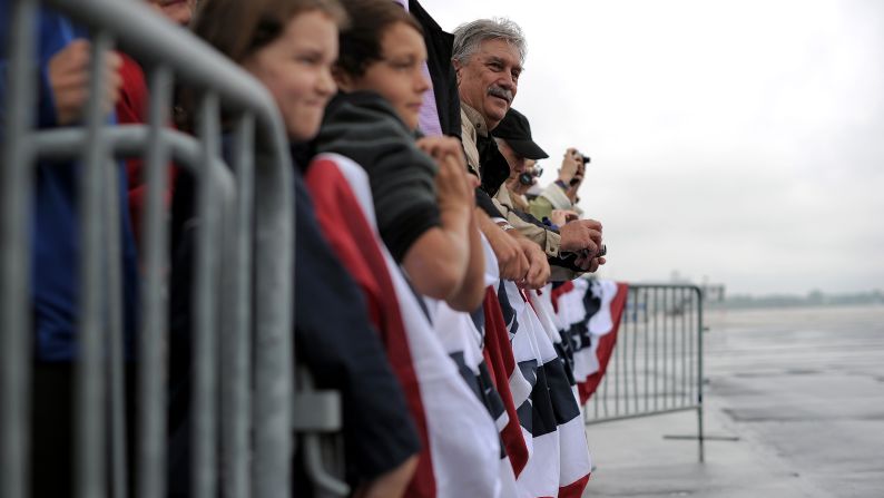 Supporters wait to see Obama on Wednesday at Toledo Express Airport in Bowling Green, Ohio. Air For One aborted an initial landing attempt in Ohio due to weather conditions.