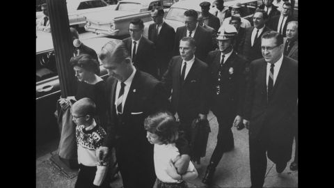 Hoffa, second row, center, leaves court after being found guilty of jury tampering in 1964.