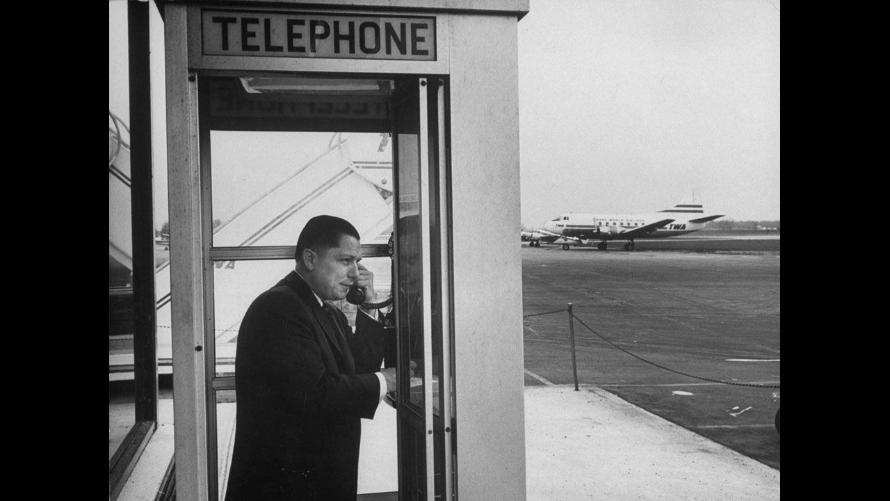 Hoffa on the phone at an airport in 1959.