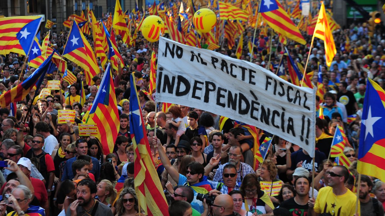 People hold pro-independence Catalan flags in a demonstration calling for independence in Barcelona.