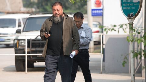  Chinese artist Ai Weiwei (C) leaves court on Thursday after his final appeal against tax evasion charges was rejected.