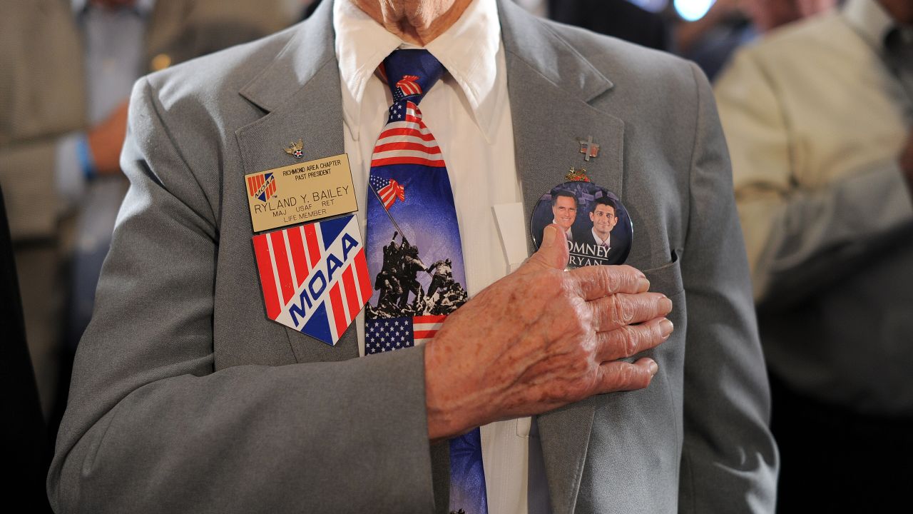 Veterans at the American Legion Post 176 pray before Romney speaks Thursday in Springfield.