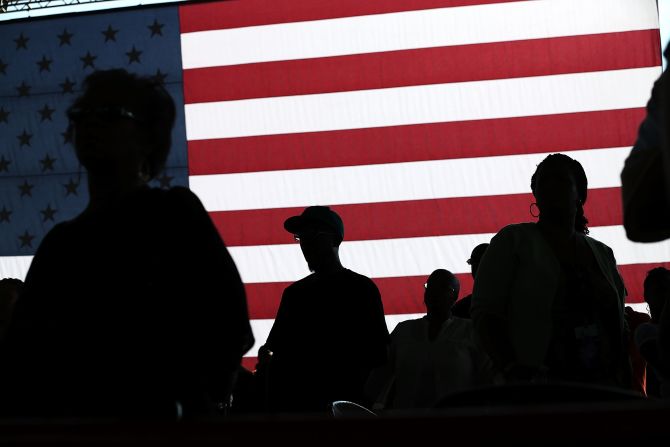 People listen to Obama speak at the Farm Bureau Live arena in Virginia Beach on Thursday.