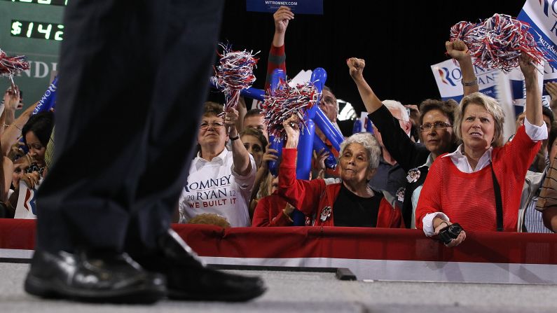 Supporters cheer as Romney speaks at SeaGate Convention Centre in Toledo, Ohio, on Wednesday, September 26.