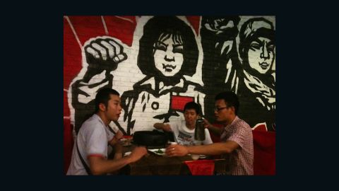 Patrons at a Cultural Revolution-themed eatery gather for snack and "red" entertainment.