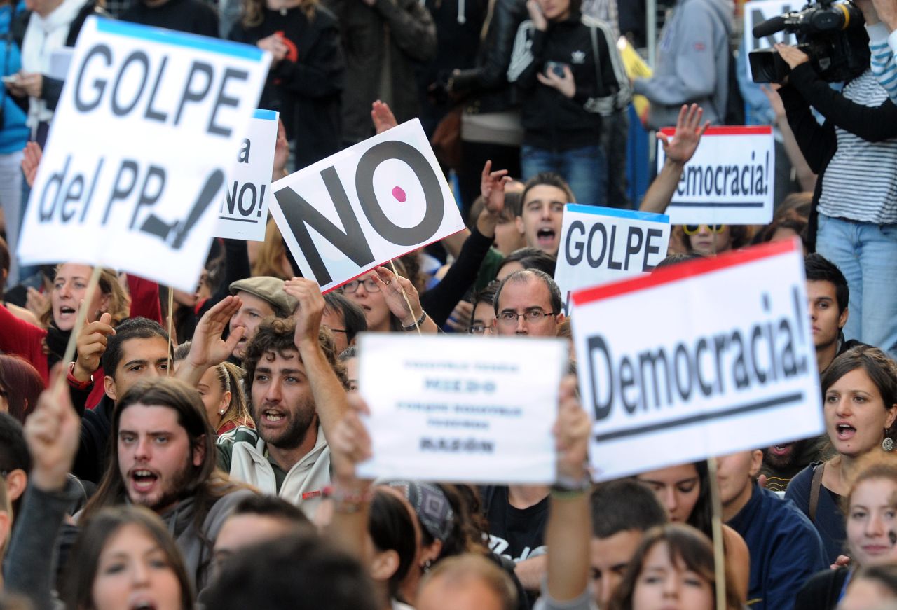 Protesters take part in a demonstration organized by Spain's 'indignant' protesters on September 26, 2012 in Madrid, a day after a mass protest in which police beat and fired rubber bullets at demonstrators. 