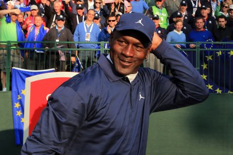 Basketball legend Michael Jordan waits on the first tee during the matches.