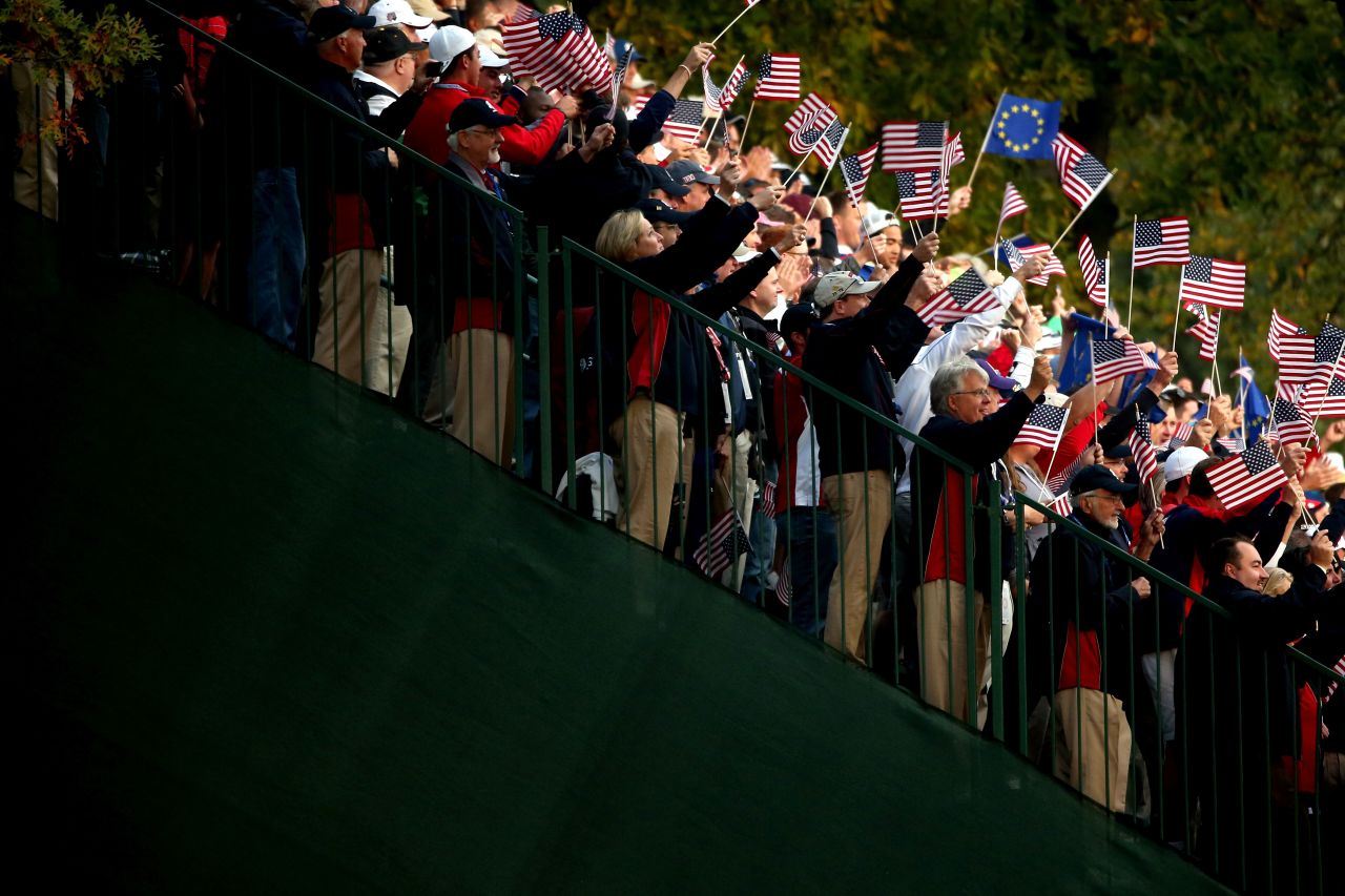 USA fans cheer the players on the first tee Friday.