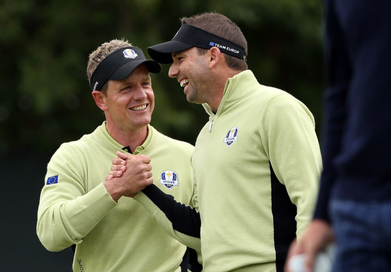 Luke Donald and Sergio Garcia of Europe celebrate on the fifth green on Friday. 