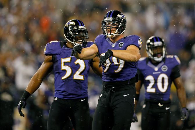 Outside linebacker Paul Kruger, center, of the Baltimore Ravens celebates after inside linebacker Ray Lewis, left, sacked Browns quarterback Brandon Weeden on Thursday.