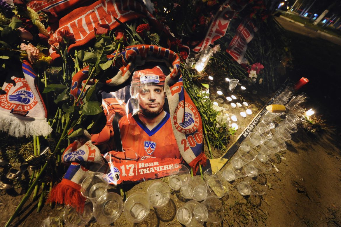 A picture of Ivan Tkachenko was surrounded by candles and glasses in front of the Lokomotiv Stadium as fans flocked to the Arena-2000 to pay their respects.