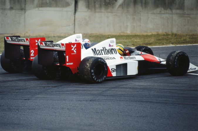 Prost and Senna (No.1) clash at the Japanese Grand Prix at Suzuka in 1989. Prost clinched the title after the Brazilian was controversially disqualified after winning the race.   