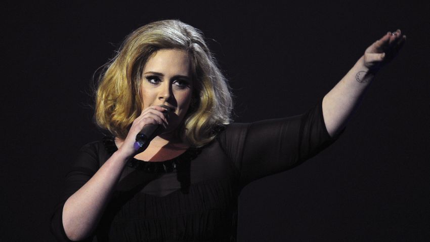 British singer-songwriter Adele accepts the British Female Solo Artist award at the BRIT Awards 2012 in London on February 21, 2012.