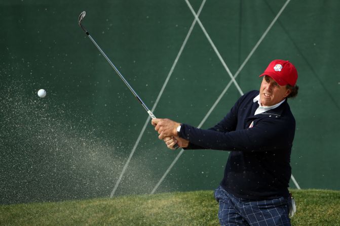 Phil Mickelson plays a bunker shot on 10th tenth hole on Friday.