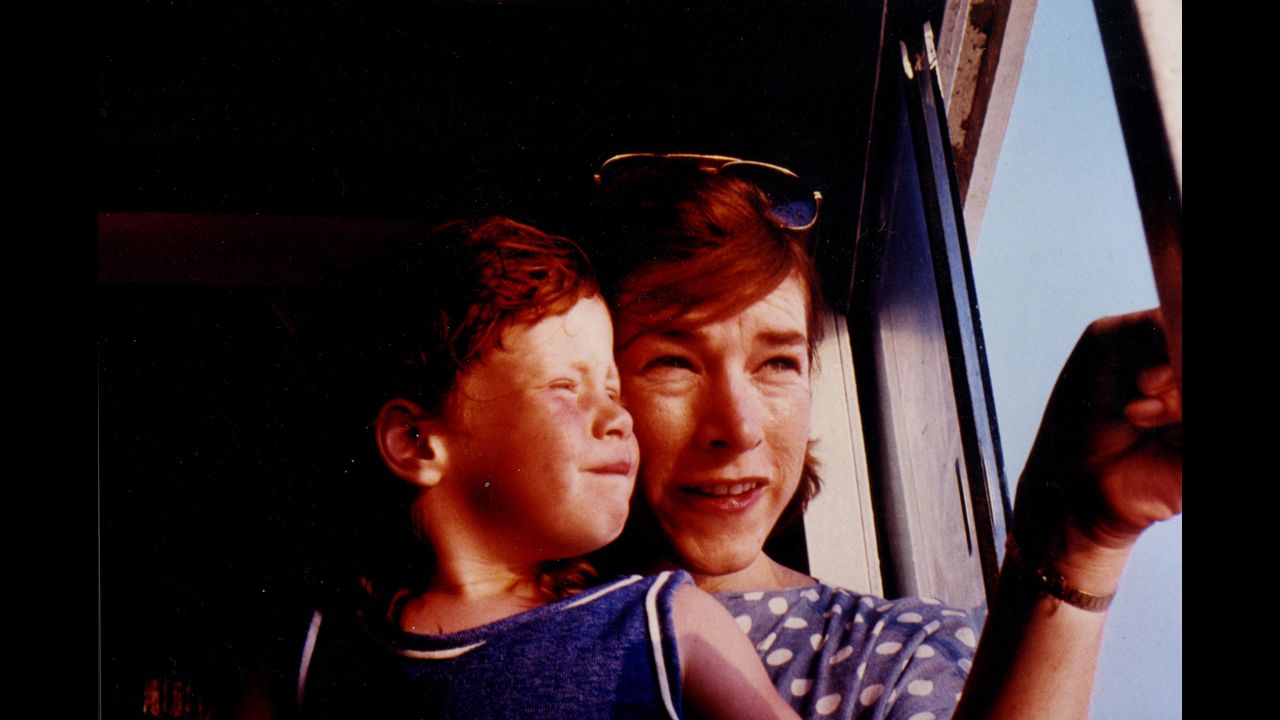 Gilbert at age 5 or 6 with her mother on a ferryboat.