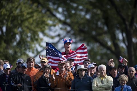 Fans watch during the morning foursome matches Friday at the Medinah Country Club.
