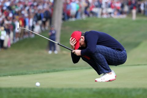 Keegan Bradley of the United States reacts after putting on the 14th green Friday.
