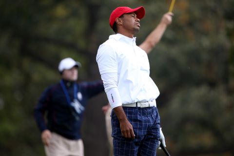 Tiger Woods of the USA reacts to a poor tee shot on the 15th hole on Friday.