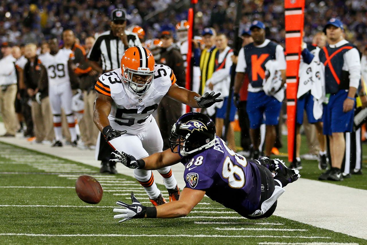 Ravens tight end Dennis Pitta, right, misses a pass against Cleveland middle linebacker D'Qwell Jackson.
