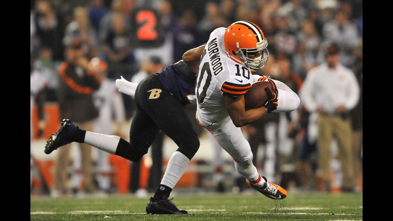 Jordan Norwood, right, of the Cleveland Browns runs the ball against the Baltimore Ravens.