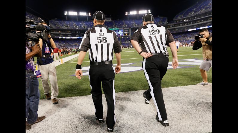 Game officials take the field before the start of the Baltimore Ravens and Cleveland Browns game on Thursday, September 27 in Baltimore, Maryland. <a href="index.php?page=&url=http%3A%2F%2Fwww.cnn.com%2F2012%2F09%2F20%2Ffootball%2Fgallery%2Fnfl-week-3%2Findex.html"><strong>Look back at the best of Week Three.</strong></a>