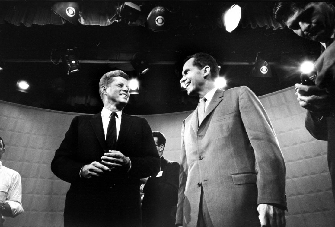 Candidates John F. Kennedy, left, and Richard Nixon exchange smiles ahead of their first TV debate.