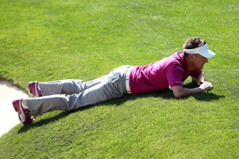 Ian Poulter of Europe lines up a putt on the 16th green on Saturday.