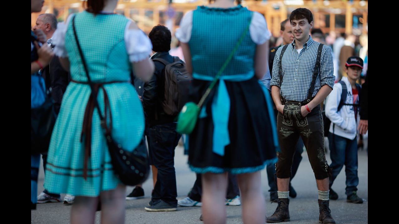 People dressed in traditional Bavarian clothing attend the beer festival.