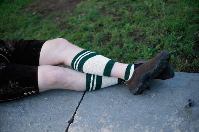 A man dressed in traditional Bavarian clothing rests.