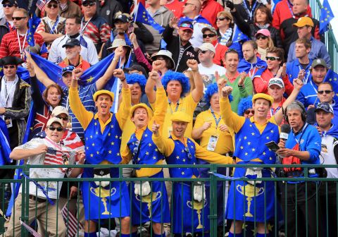 European fans cheer at the start of the final day of play at the 39th Ryder Cup on Sunday.