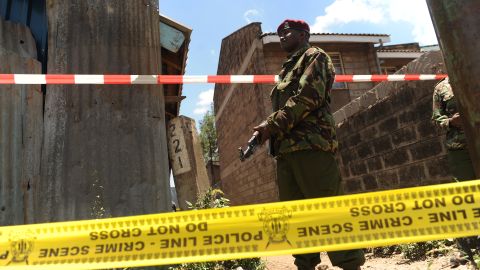 A policeman stands guard next to the scene where a blast ripped through a church in Nairobi on September 30, 2012. 