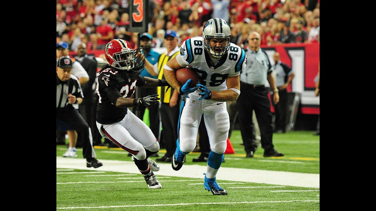 Greg Olsen of the Carolina Panthers makes a catch and runs for a touchdown against the Atlanta Falcons on Sunday.