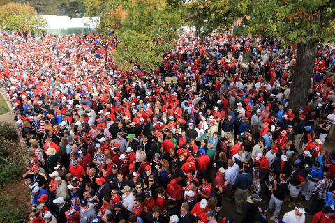 A sea of fans crowds around the first tee near the clubhouse Sunday.