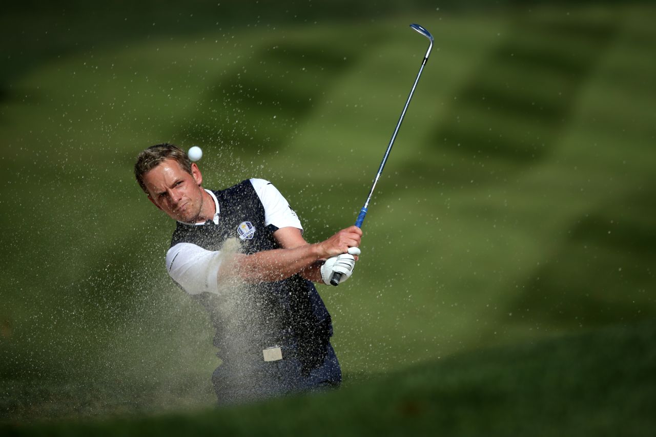 Luke Donald of Europe plays a bunker shot on the fifth hole on Sunday.