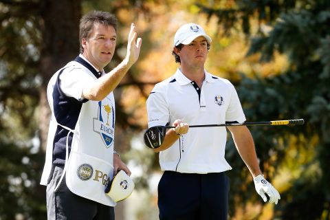 Rory McIlroy of Europe lines up a shot with his caddie J.P. Fitzgerald on the third tee on Sunday.