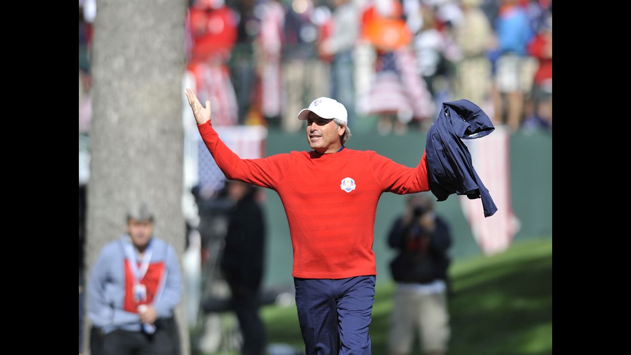 Team USA Assistant Captain Fred Couples stirs up the crowd during play Sunday.