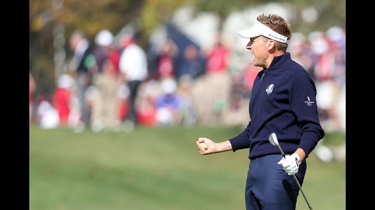 Ian Poulter of Europe celebrates after making a birdie on the first hole Sunday.