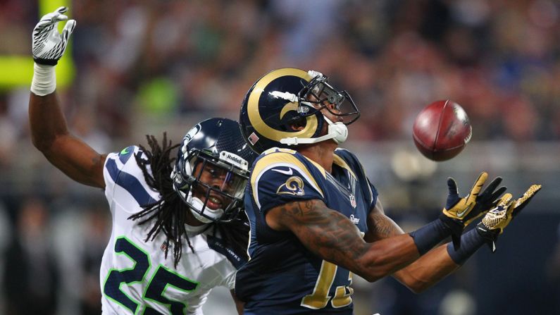 Chris Givens of the St. Louis Rams makes a catch against Richard Sherman of the Seattle Seahawks at Edward Jones Dome in St. Louis on Sunday.