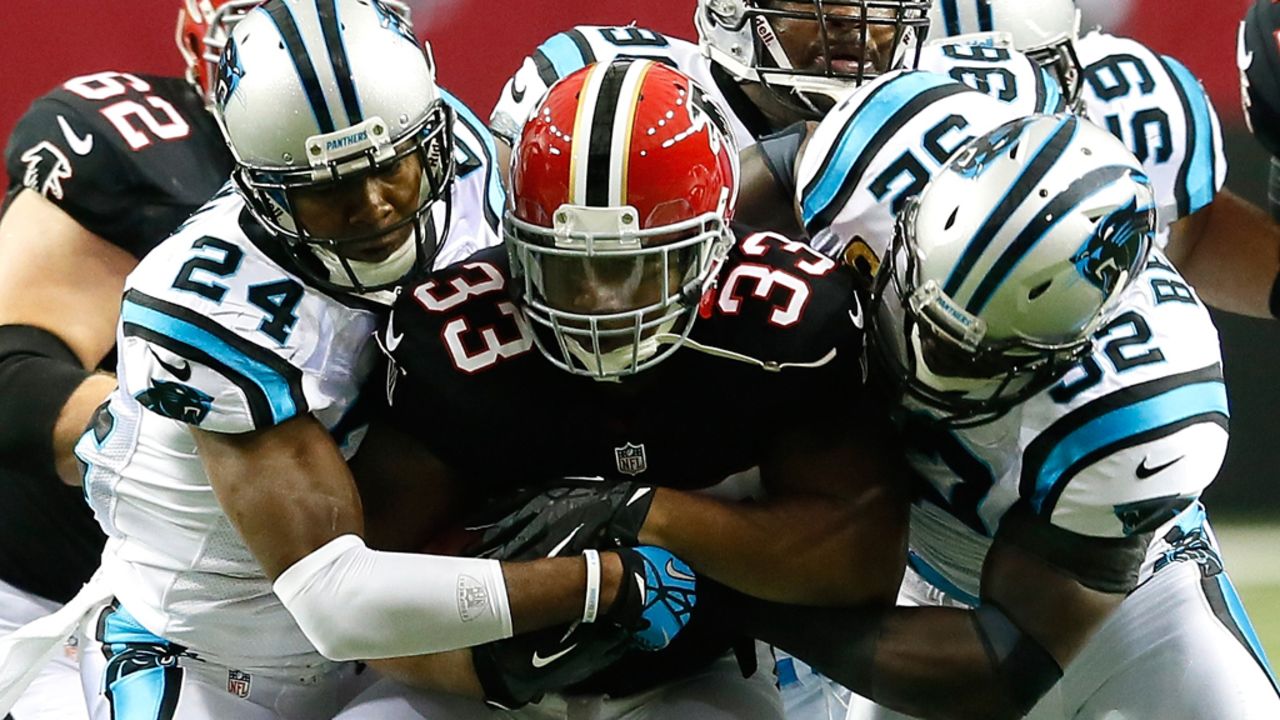 Michael Turner of the Atlanta Falcons is tackled during Sunday's game against the Carolina Panthers at the Georgia Dome in Atlanta.