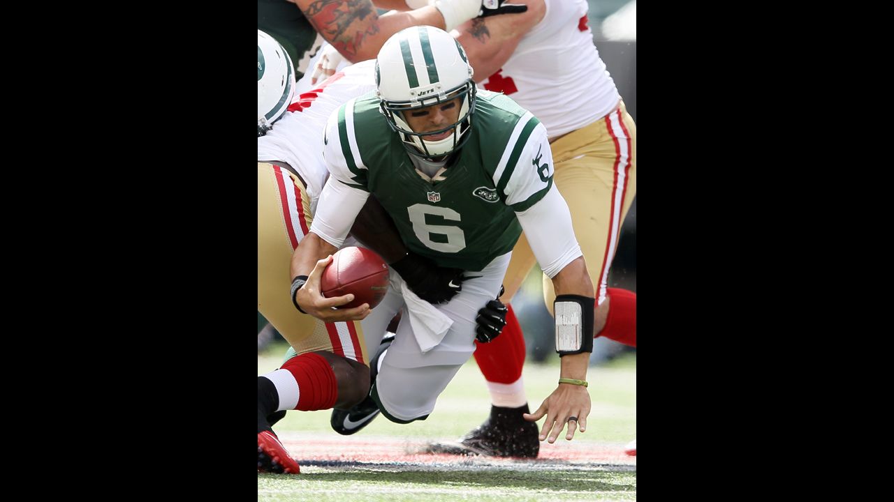 Quarterback Mark Sanchez of the New York Jets is sacked in the first quarter against the San Francisco 49ers on Sunday.