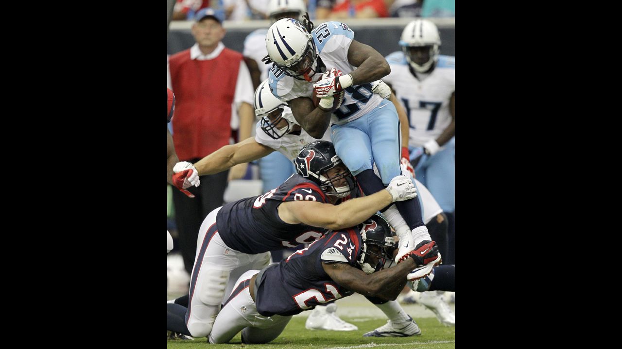 Chris Johnson of the Tennessee Titans is tackled during Sunday's game against the Houston Texans.
